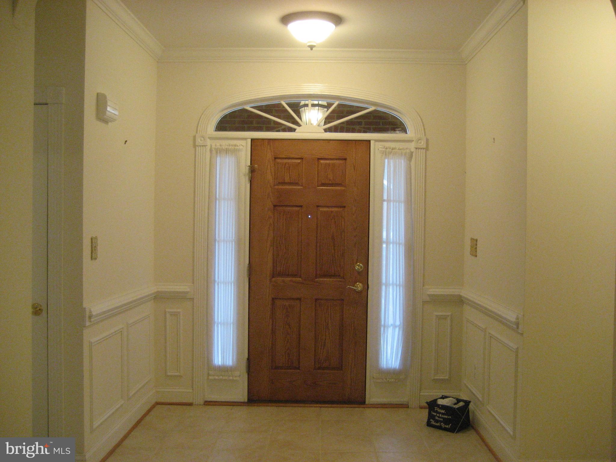 180 Carriage Chase Circle Warrenton, VA 20186 - Photo 5 of 22 a view of a hallway with wooden door