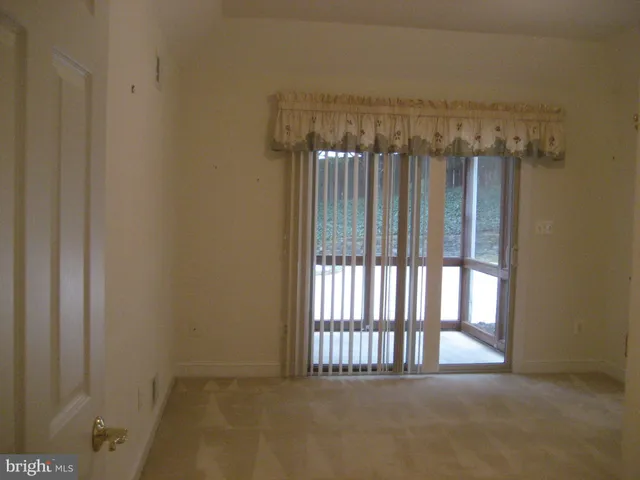 a view of a room that has a large window