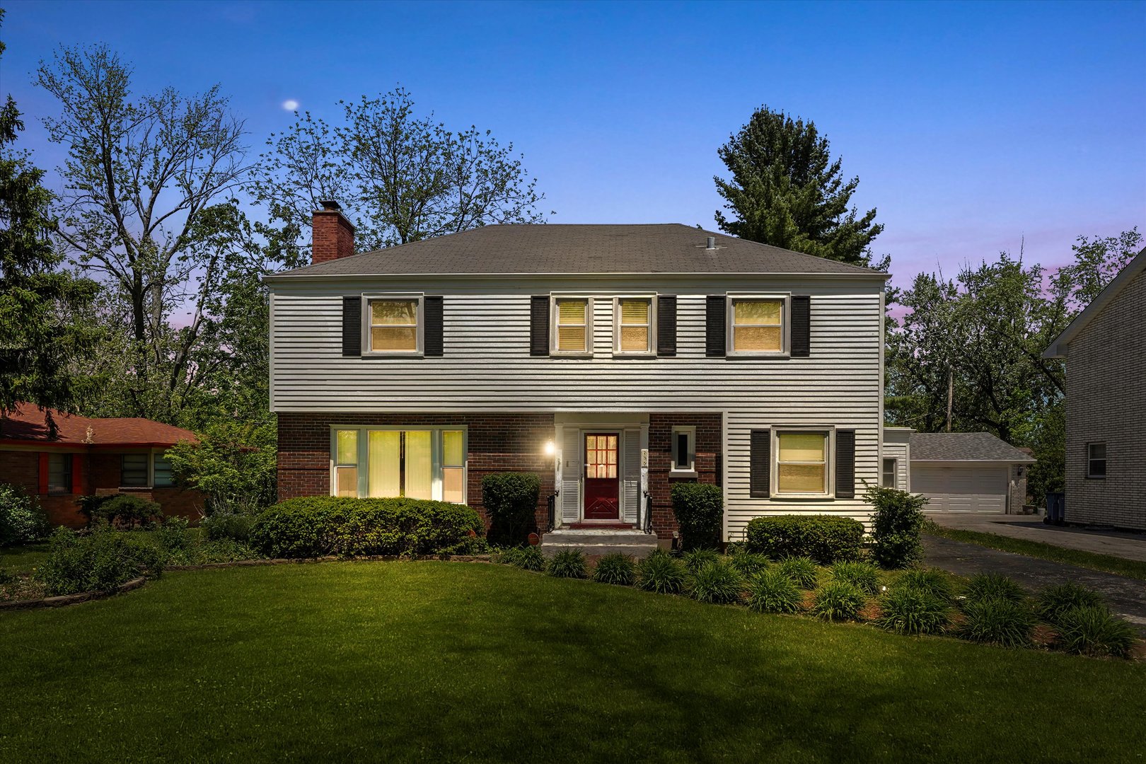 255 Irving Boulevard Chicago Heights, IL 60411 - Photo 1 of 42 a front view of a house with a yard and trees