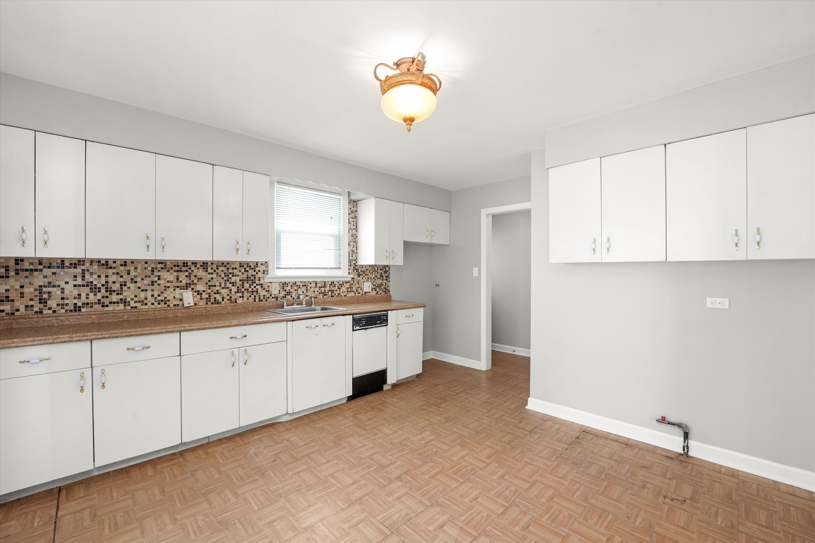 255 Irving Boulevard Chicago Heights, IL 60411 - Photo 17 of 42 a kitchen with granite countertop white cabinets and white appliances