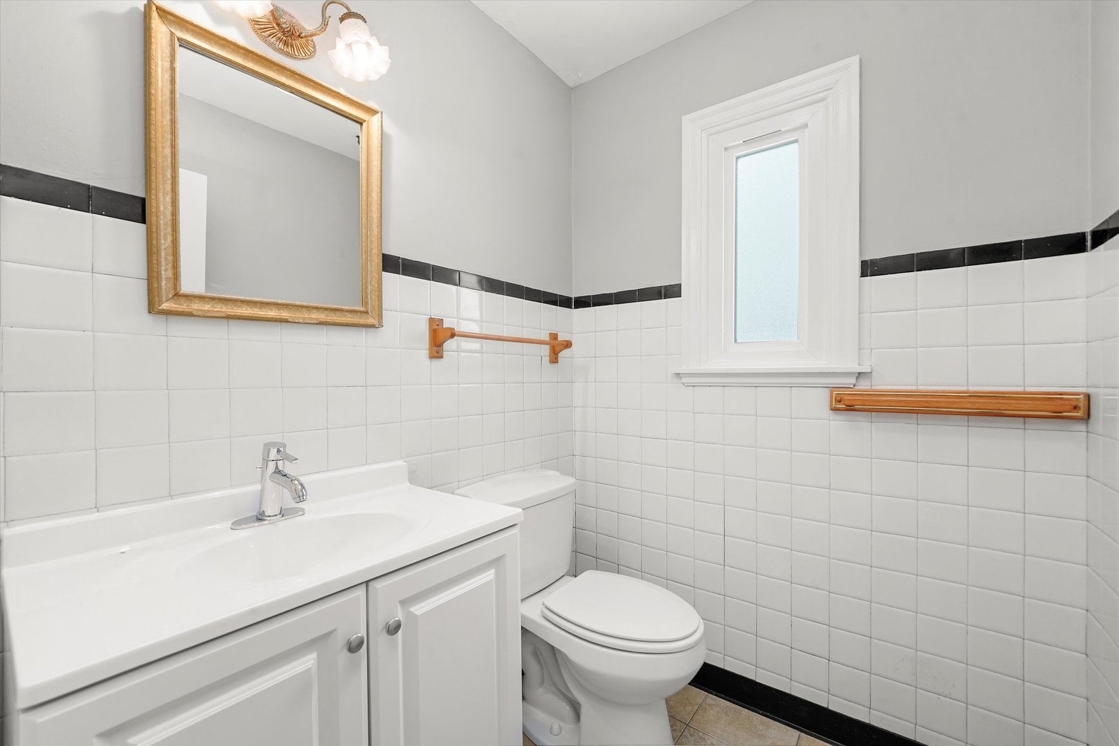 255 Irving Boulevard Chicago Heights, IL 60411 - Photo 19 of 42 a bathroom with a sink a toilet and mirror