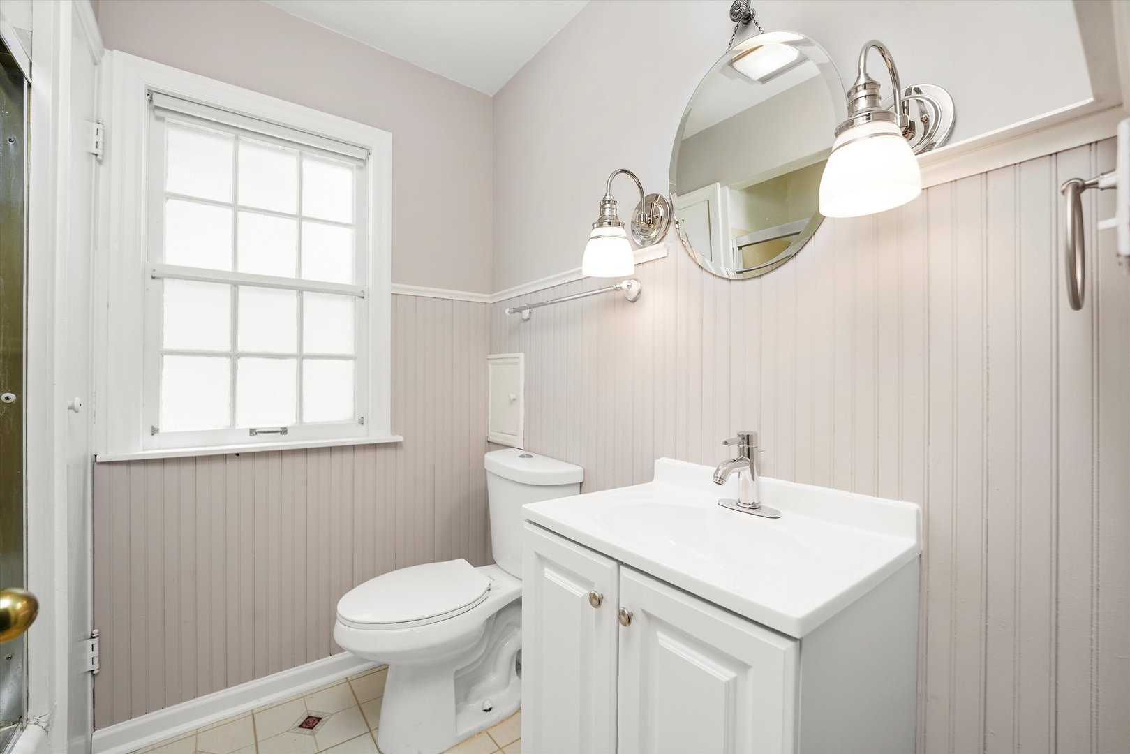 255 Irving Boulevard Chicago Heights, IL 60411 - Photo 29 of 42 a bathroom with a sink a toilet and a mirror