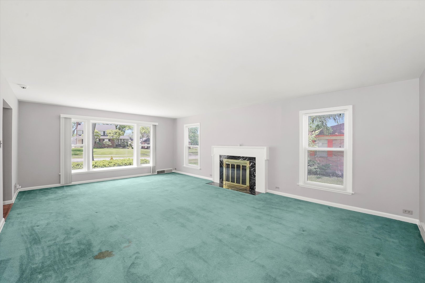 255 Irving Boulevard Chicago Heights, IL 60411 - Photo 7 of 42 a view of a big room with windows and fireplace