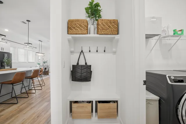 a view of a kitchen with kitchen island and stainless steel appliances