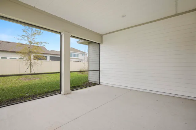 a close view of walk in closet with clothes