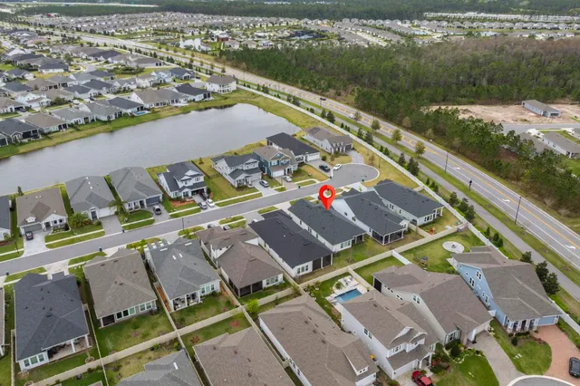 an aerial view of residential houses with outdoor space