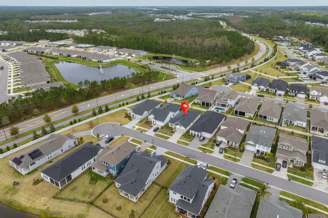 an aerial view of residential houses with outdoor space
