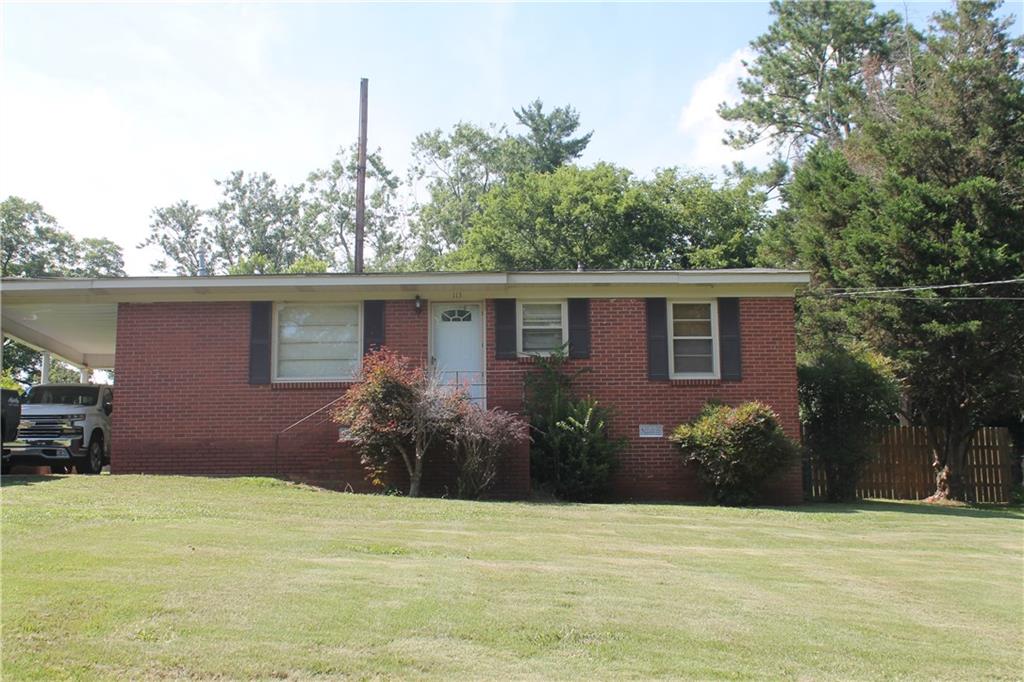 113 Robin Hood Road Northeast Rome, GA 30161 - Photo 1 of 1 a view of a house with a backyard