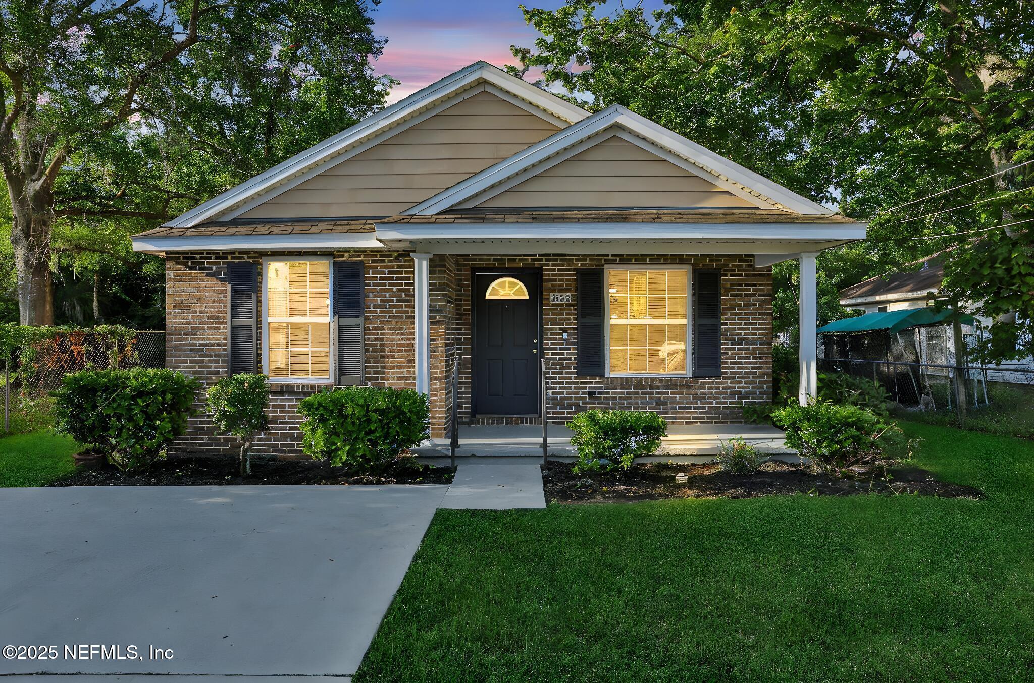2122 Brooklyn Road Jacksonville, FL 32209 - Photo 1 of 19 a front view of a house with a yard