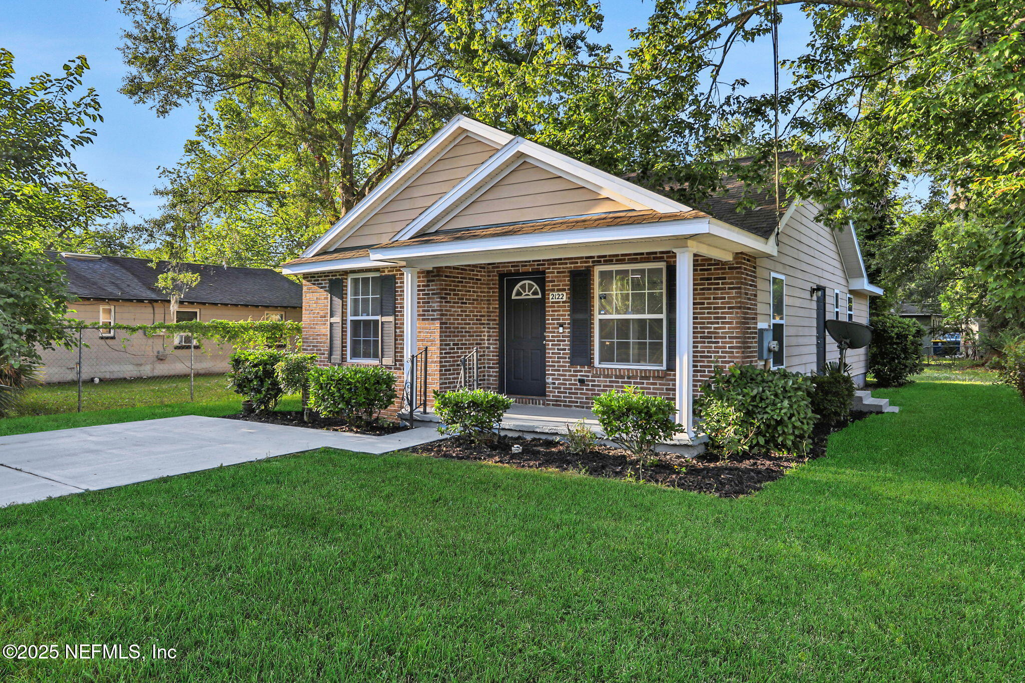 2122 Brooklyn Road Jacksonville, FL 32209 - Photo 17 of 19 a view of a house with a yard and large trees