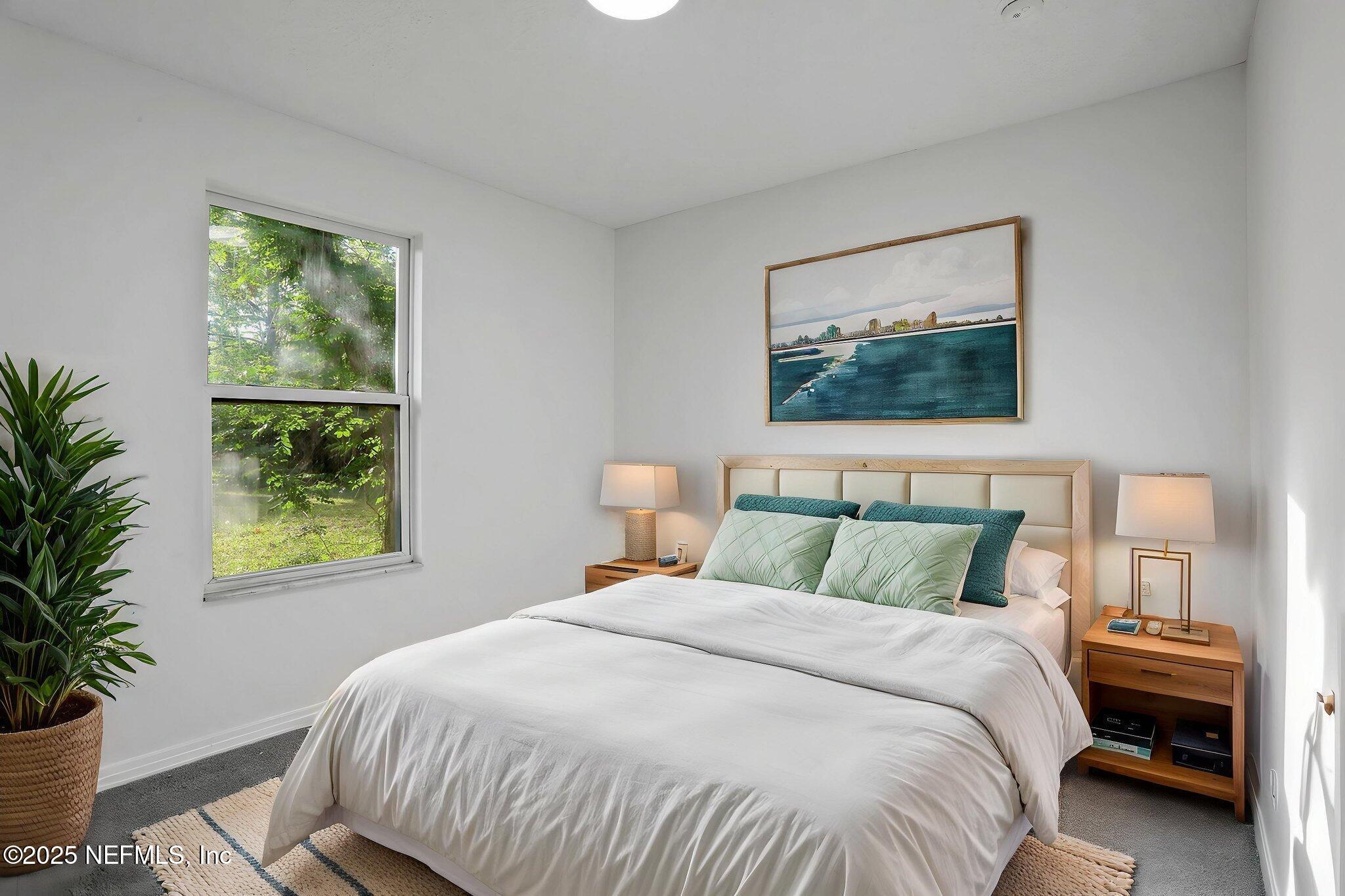 2122 Brooklyn Road Jacksonville, FL 32209 - Photo 10 of 19 a bedroom with a bed and a painting on the wall