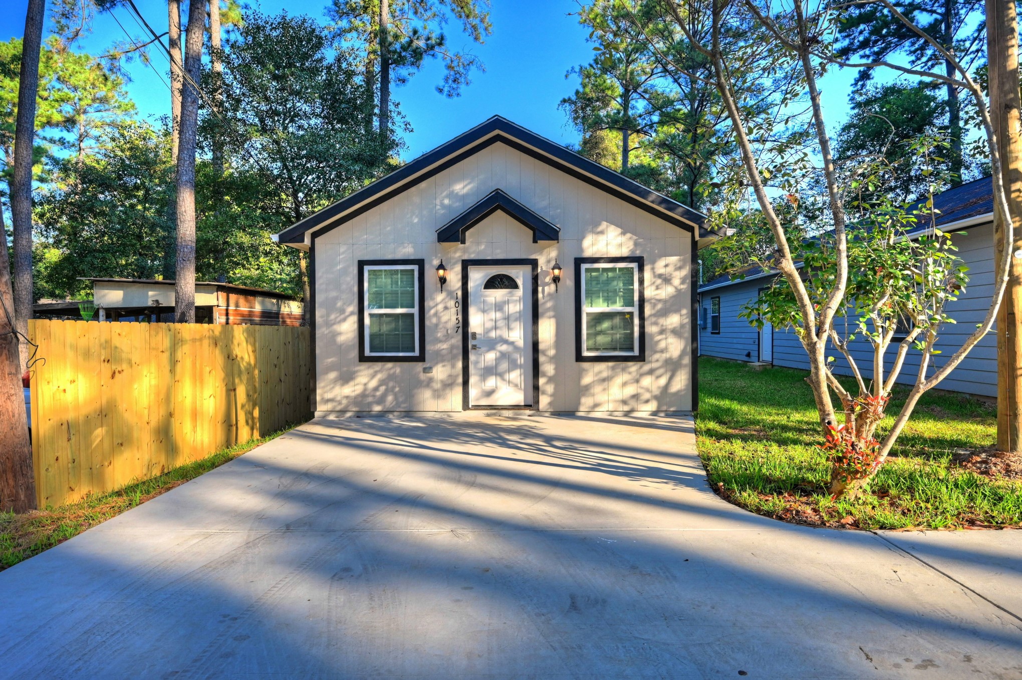 10157 Barberry Street Willis, TX 77318 - Photo 1 of 36 a front view of a house with a yard