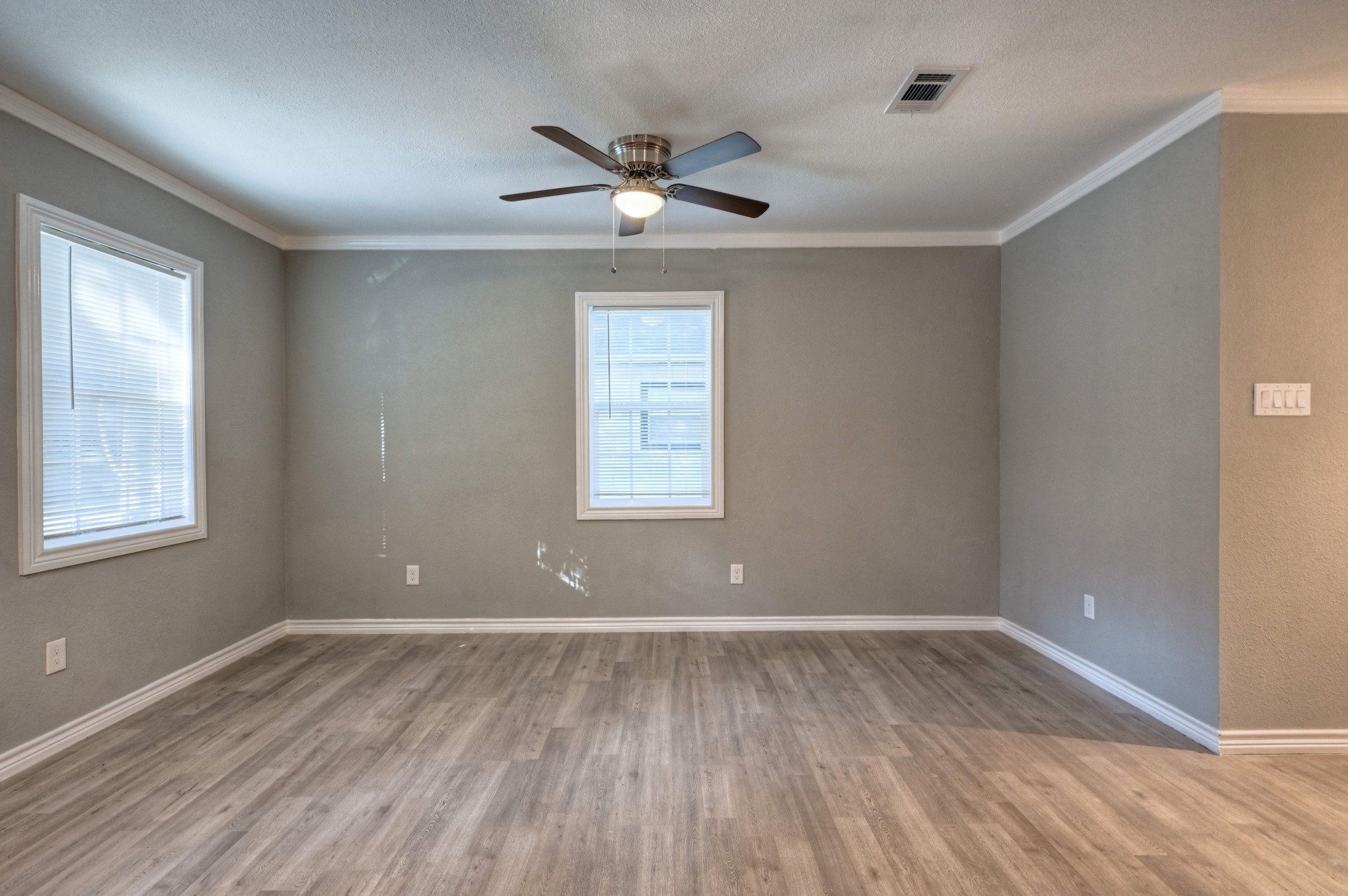 10157 Barberry Street Willis, TX 77318 - Photo 11 of 36 a view of room with window ceiling fan and hardwood floor