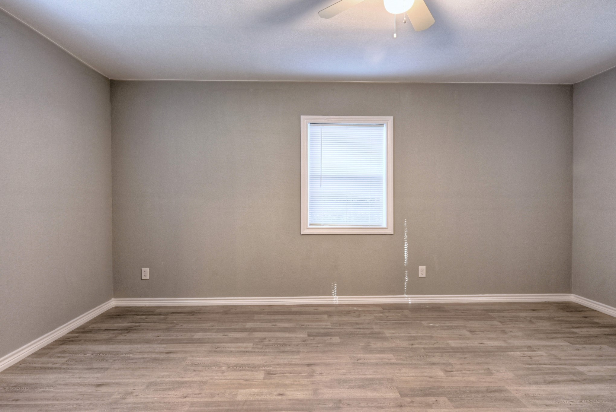 10157 Barberry Street Willis, TX 77318 - Photo 20 of 36 a view of a room with wooden floor and a window