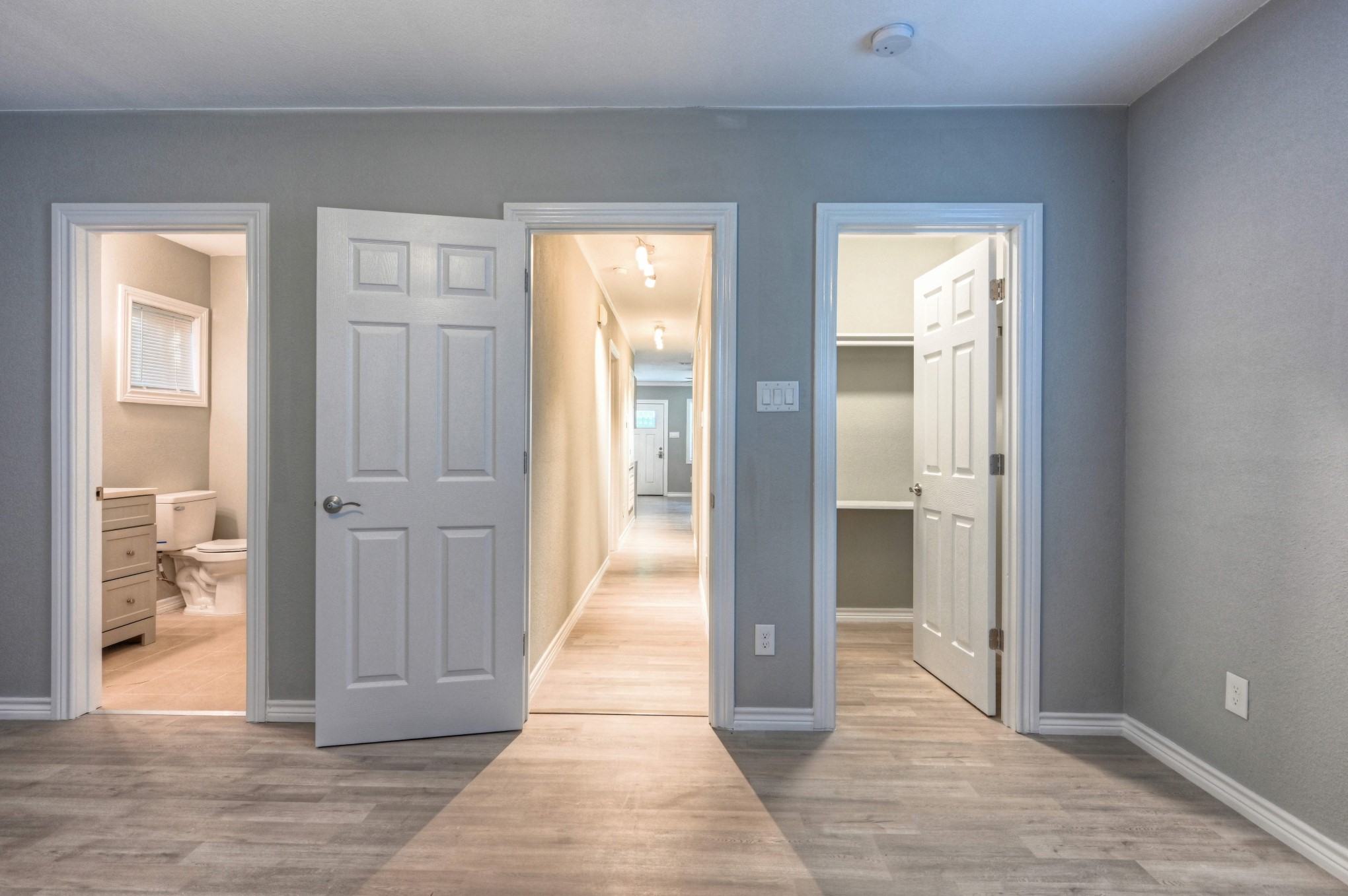 10157 Barberry Street Willis, TX 77318 - Photo 26 of 36 a view of a hallway with wooden floor and a living room