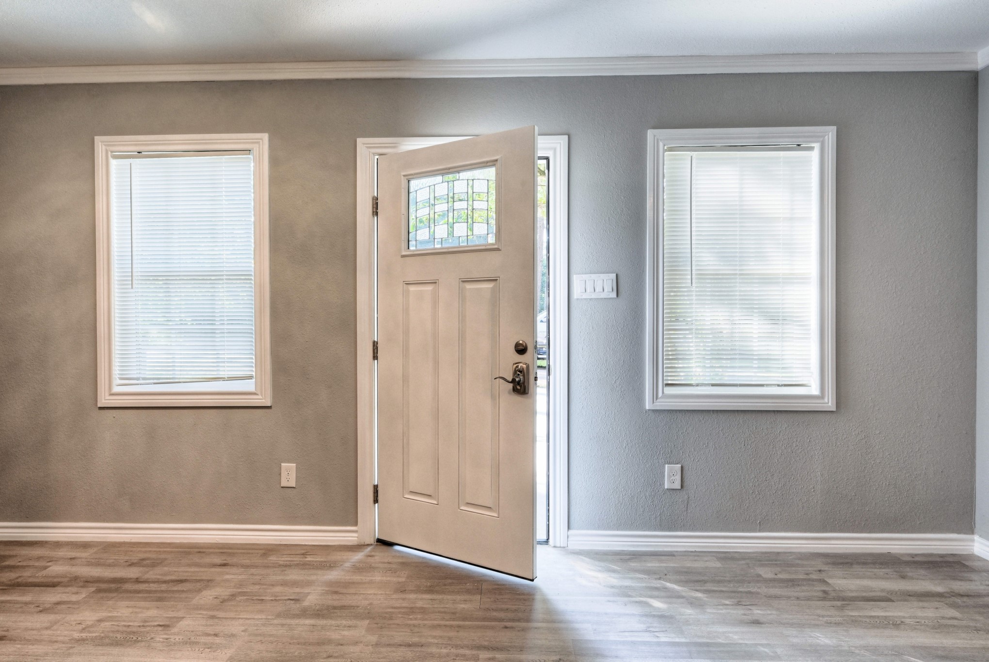 10157 Barberry Street Willis, TX 77318 - Photo 28 of 36 a view of an empty room with wooden floor and a window