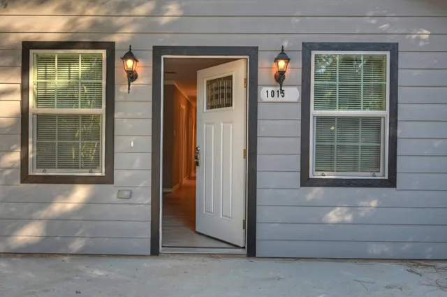 a front view of a house with a glass door and door