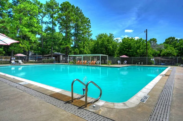 a view of a swimming pool with a patio