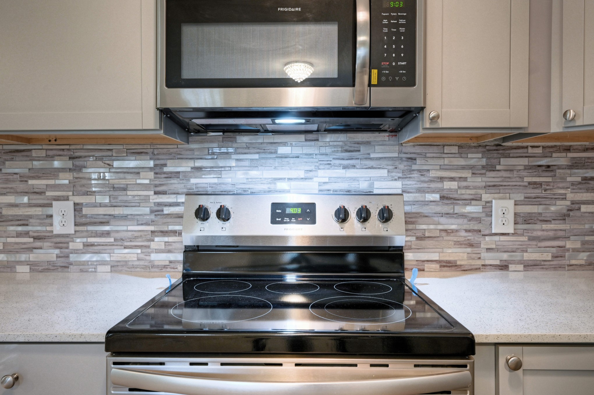 10157 Barberry Street Willis, TX 77318 - Photo 10 of 36 a stove top oven sitting inside of a kitchen