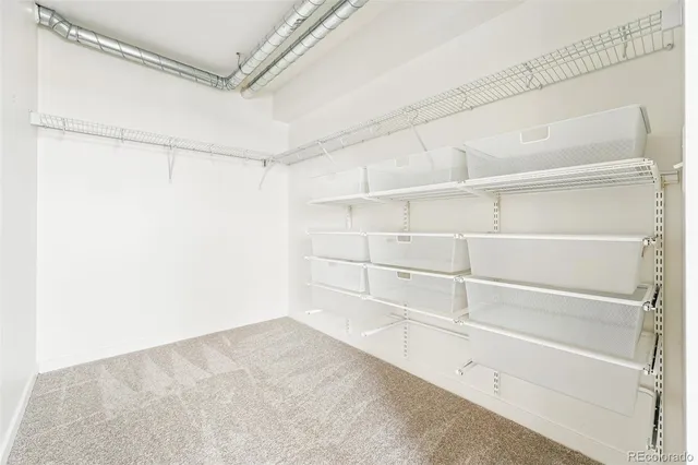 a view of an empty walk in closet