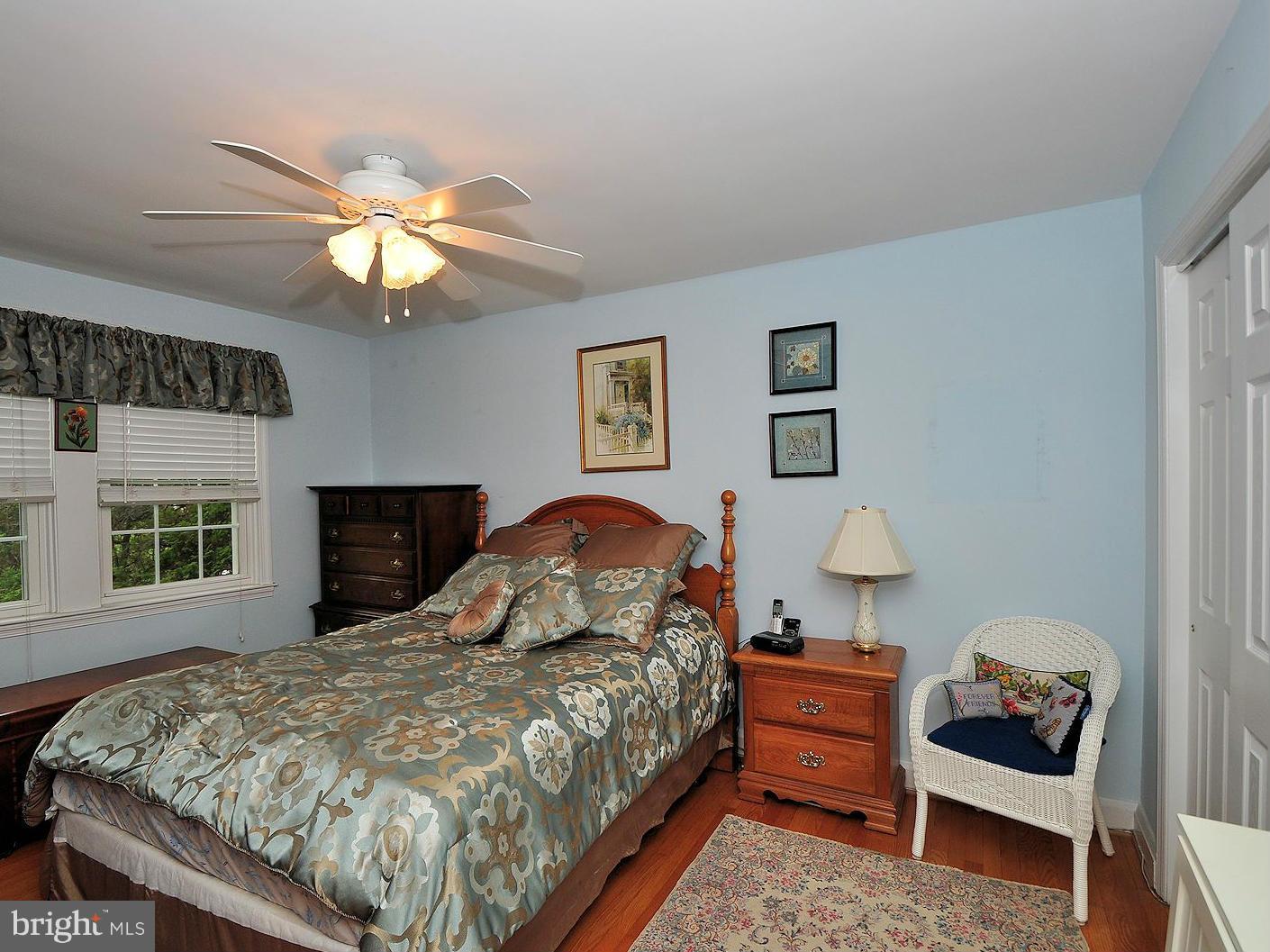 104 Overbrook Road Baltimore, MD 21212 - Photo 11 of 27 a bedroom with a bed and a chandelier