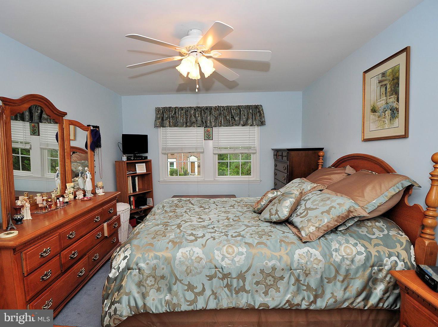 104 Overbrook Road Baltimore, MD 21212 - Photo 12 of 27 a bedroom with a bed and a flat tv screen on dresser