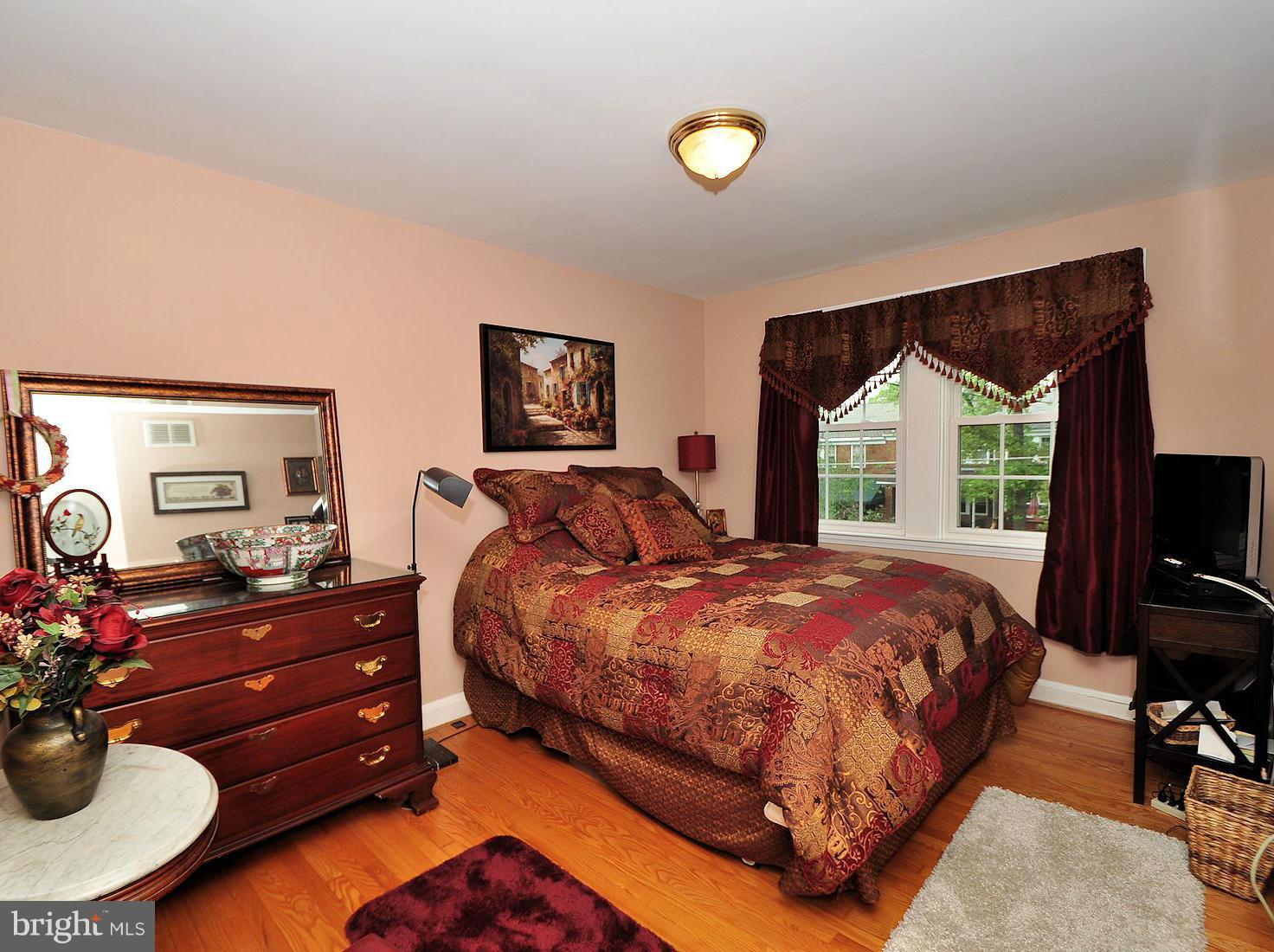 104 Overbrook Road Baltimore, MD 21212 - Photo 13 of 27 a bed room with a bed and a television