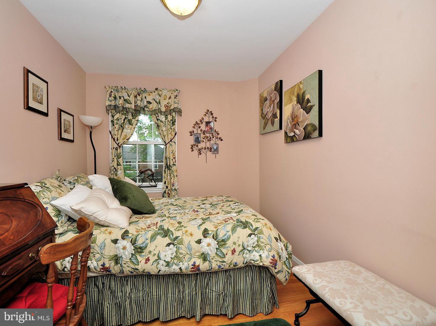 104 Overbrook Road Baltimore, MD 21212 - Photo 14 of 27 a bedroom with a bed and a dresser