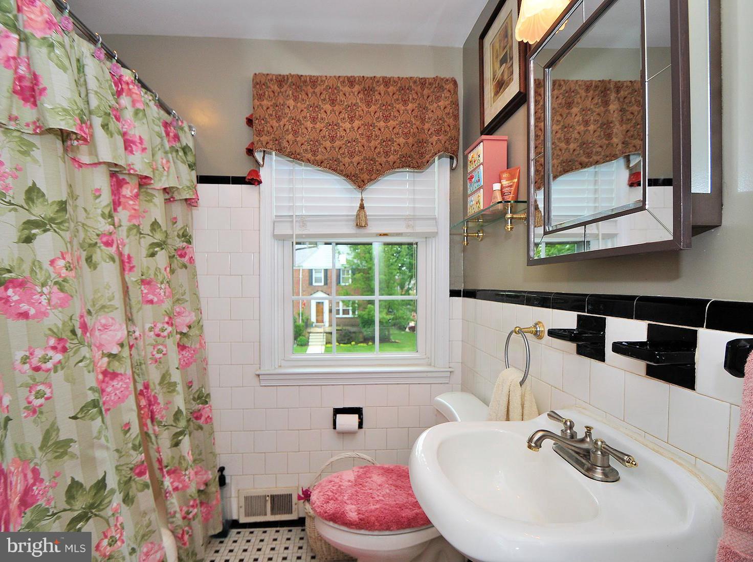 104 Overbrook Road Baltimore, MD 21212 - Photo 15 of 27 a bathroom with a sink and a mirror