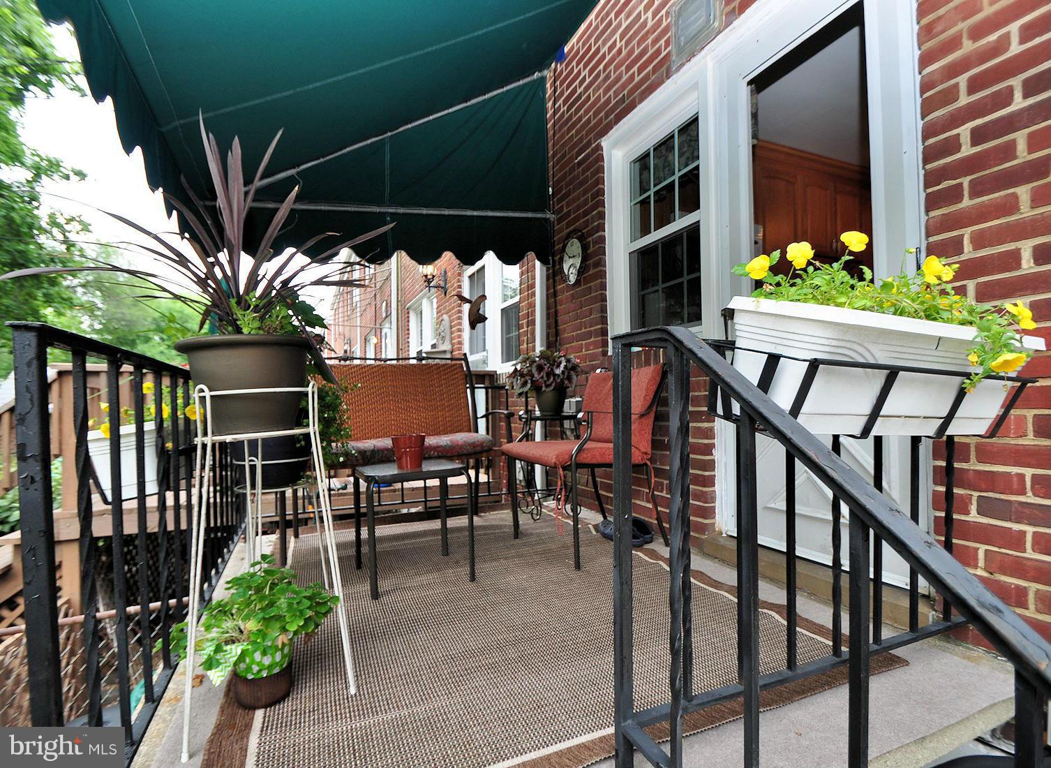 104 Overbrook Road Baltimore, MD 21212 - Photo 21 of 27 a view of a chairs and table in the patio