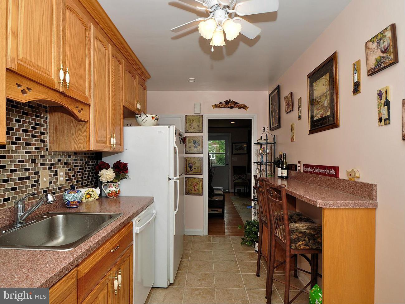 104 Overbrook Road Baltimore, MD 21212 - Photo 8 of 27 a kitchen with a sink stove and refrigerator