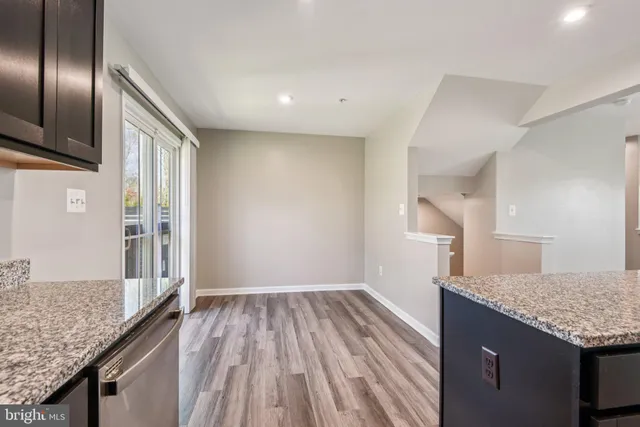 a view of a kitchen from the hallway