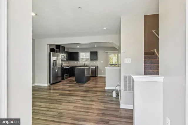 a view of kitchen with wooden floor