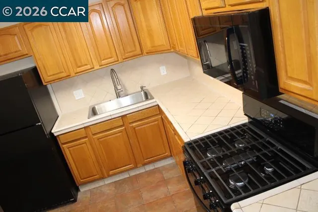 a close view of stove and microwave