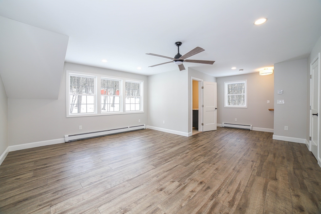 3 Woods Road Westminster, MA 01473 - Photo 30 of 42 a view of an empty room with wooden floor and a window