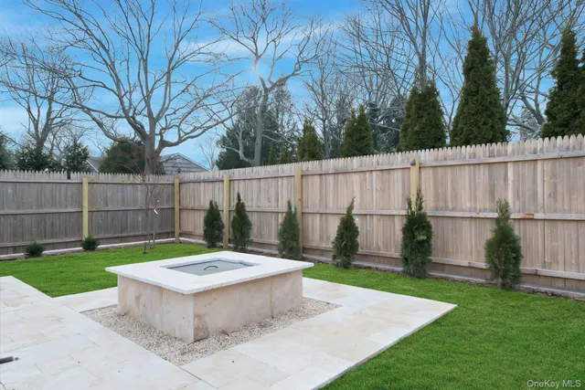 a view of a backyard with a small cabin and a chair