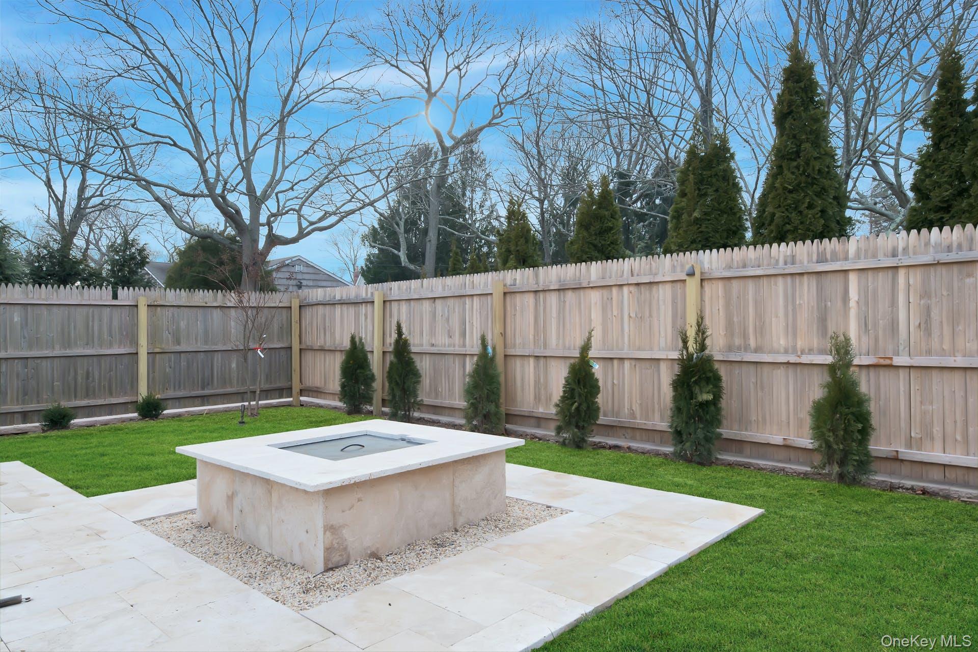 550 Krause Road Mattituck, NY 11952 - Photo 25 of 34 a view of a backyard with a small cabin and a chair