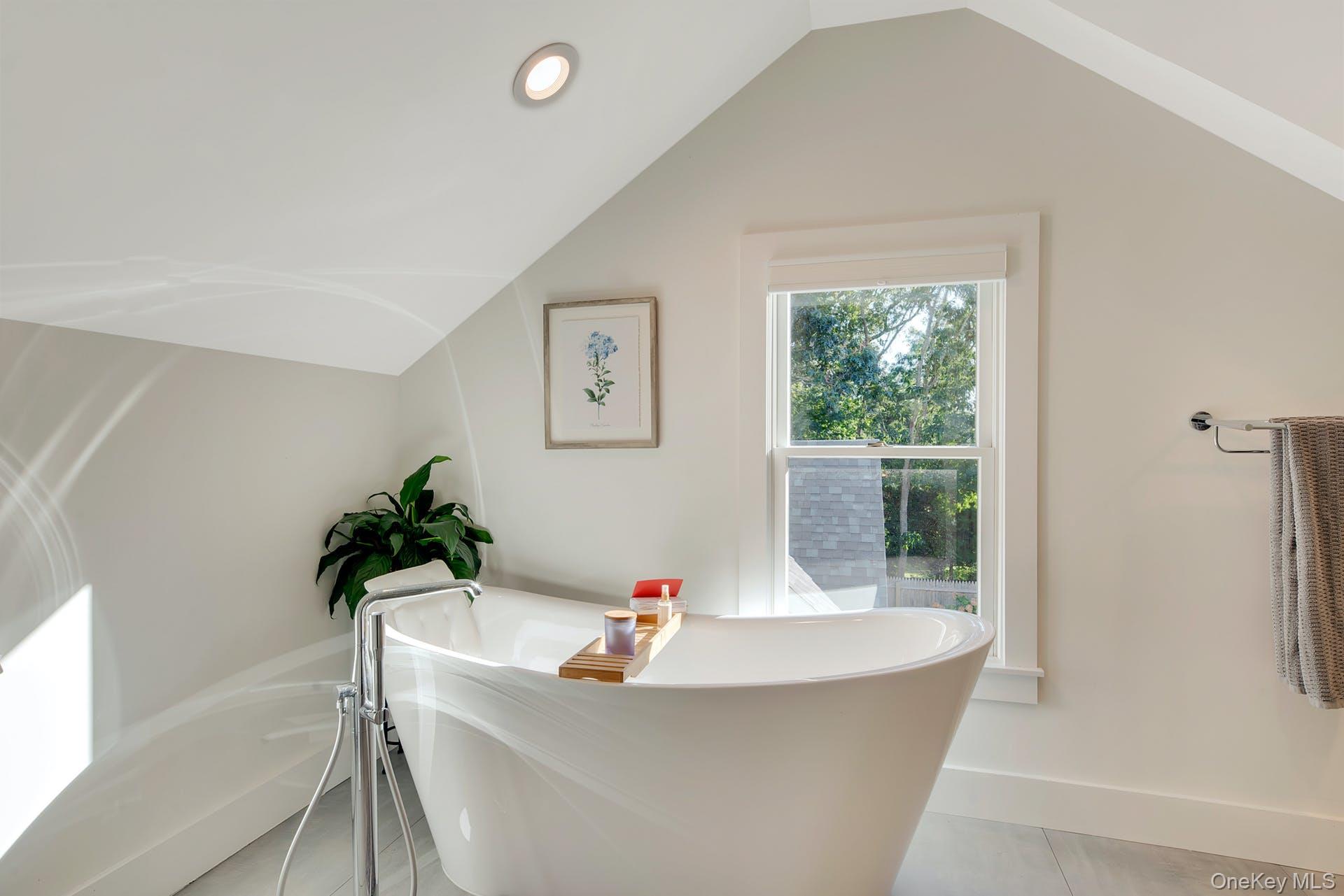 550 Krause Road Mattituck, NY 11952 - Photo 31 of 34 a white bath tub sitting in a bathroom