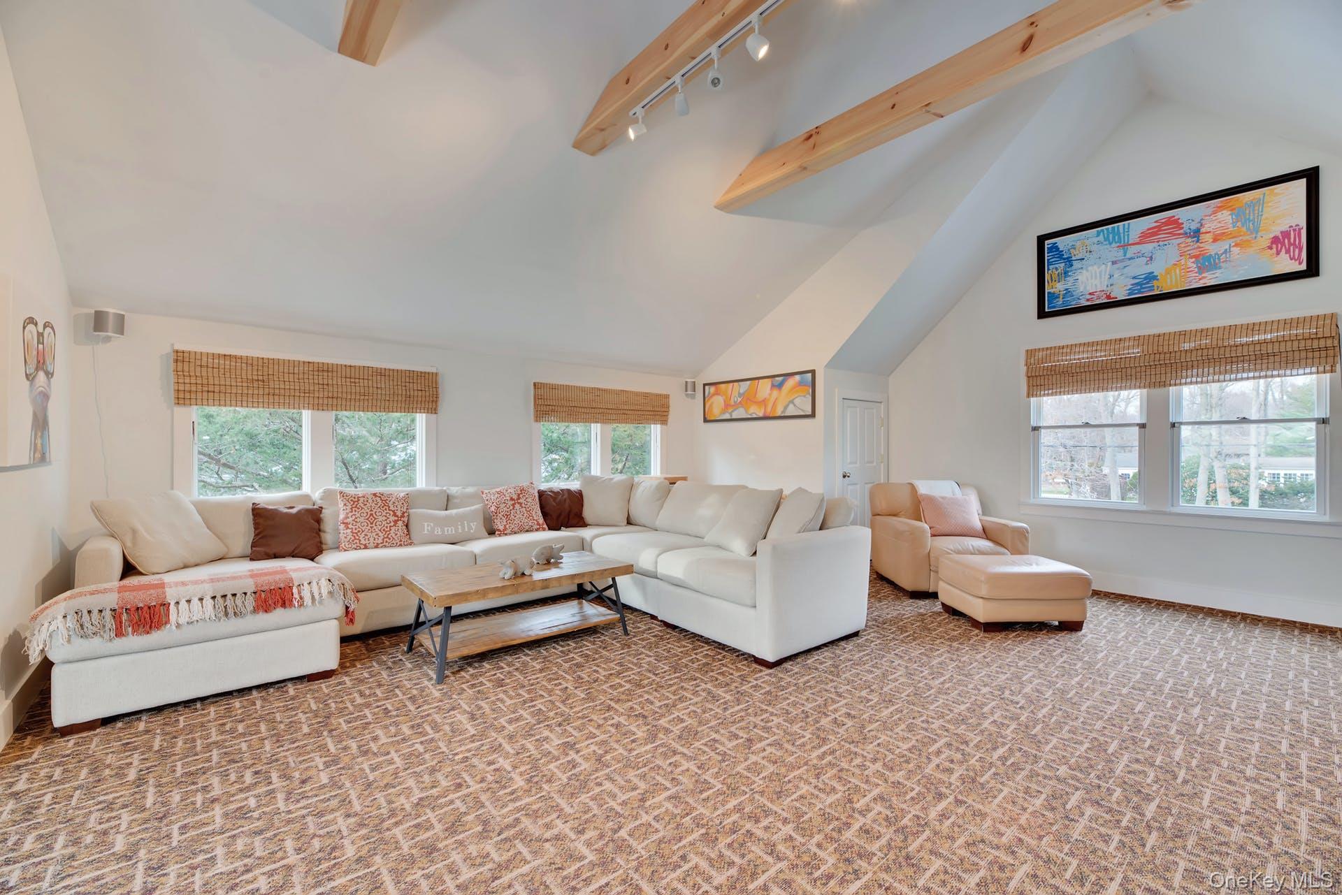 550 Krause Road Mattituck, NY 11952 - Photo 7 of 34 a living room with furniture and a flat screen tv