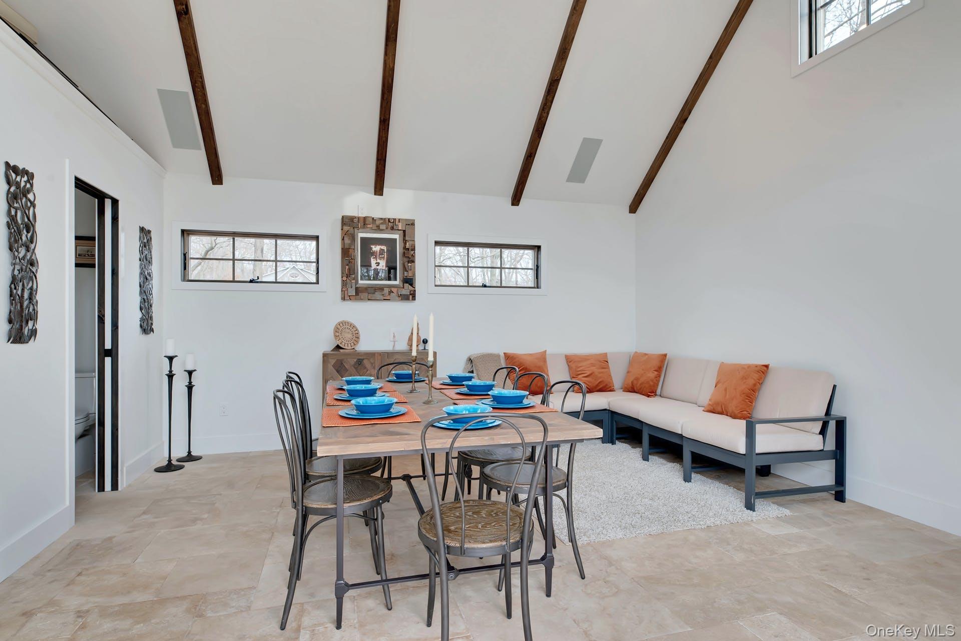 550 Krause Road Mattituck, NY 11952 - Photo 9 of 34 a dining room with furniture and wooden floor
