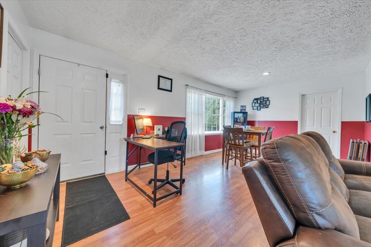 3870 Goose Dam Road Rocky Mount, VA 24151 - Photo 5 of 44 a living room with furniture and a flat screen tv