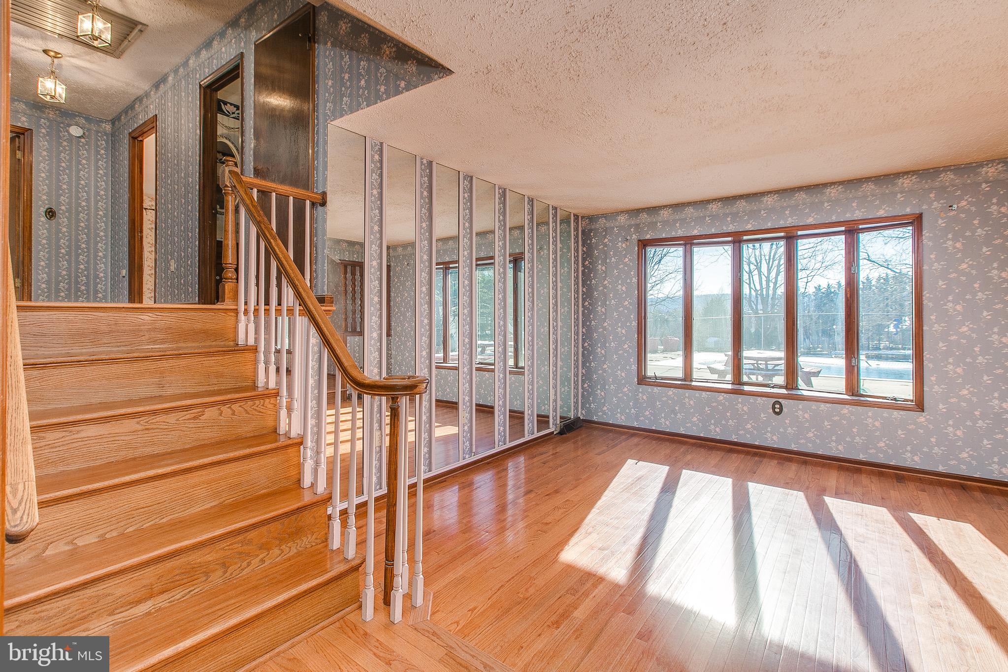 4249 Horine Road Jefferson, MD 21755 - Photo 15 of 33 Hardwood floors in liv. rm., staircase & hall