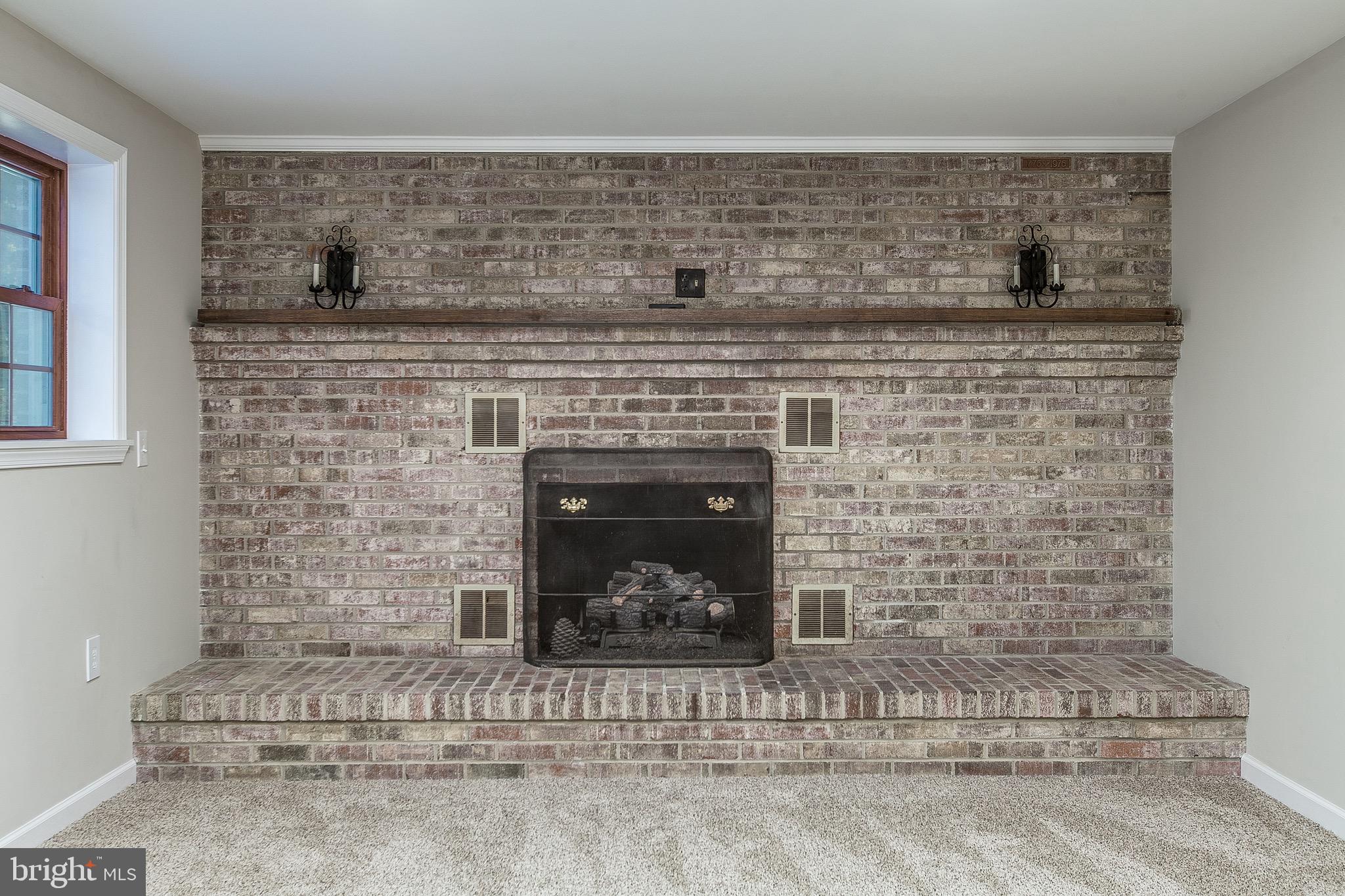4249 Horine Road Jefferson, MD 21755 - Photo 28 of 33 Newly renovated basement with brick fireplace