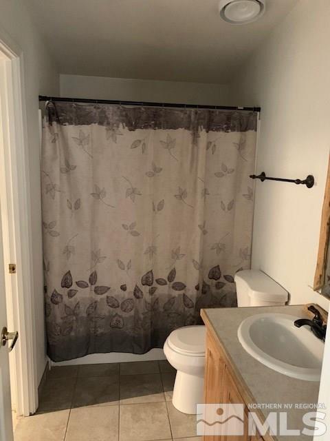 14990 Kivett Lane Reno, NV 89521 - Photo 11 of 16 a bathroom with a sink and a mirror
