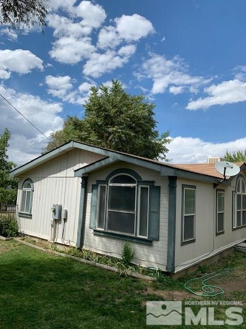 14990 Kivett Lane Reno, NV 89521 - Photo 13 of 16 a front view of a house with a garden