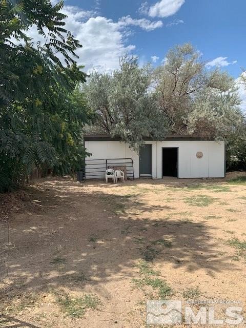 14990 Kivett Lane Reno, NV 89521 - Photo 15 of 16 a view of a swimming pool with a house