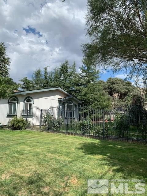 14990 Kivett Lane Reno, NV 89521 - Photo 16 of 16 a view of house in front of a big yard with large trees