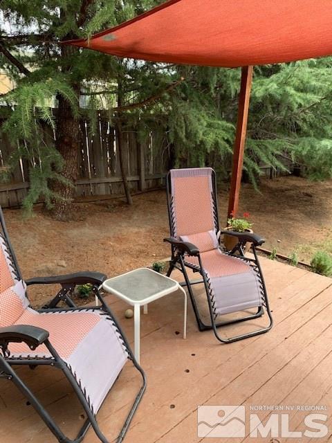 14990 Kivett Lane Reno, NV 89521 - Photo 7 of 16 a couple of blue chairs sitting in a backyard