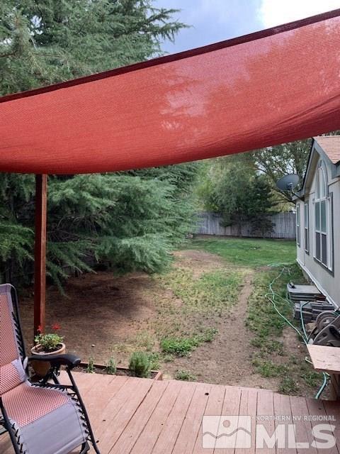 14990 Kivett Lane Reno, NV 89521 - Photo 8 of 16 a view of a backyard with a garden and chair