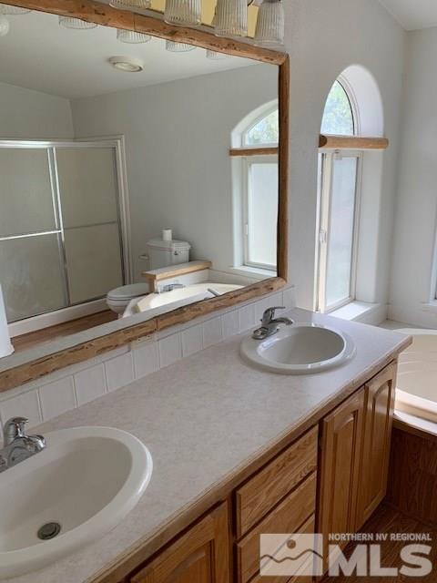 14990 Kivett Lane Reno, NV 89521 - Photo 10 of 16 a bathroom with a sink and a mirror